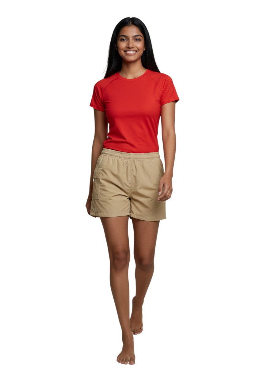 Kiefer RISE Female Solid Board Short in tan nylon with elastic waistband and side pocket. 3" inseam.