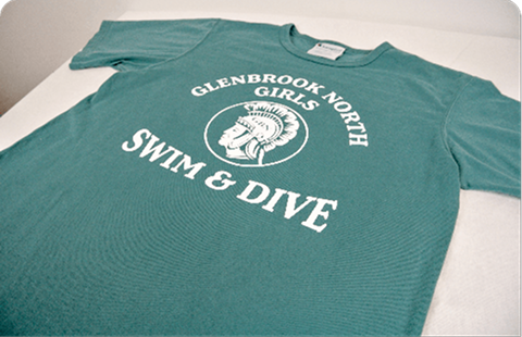 Green t-shirt with 'Glenbrook North Girls Swim & Dive' text on a white surface