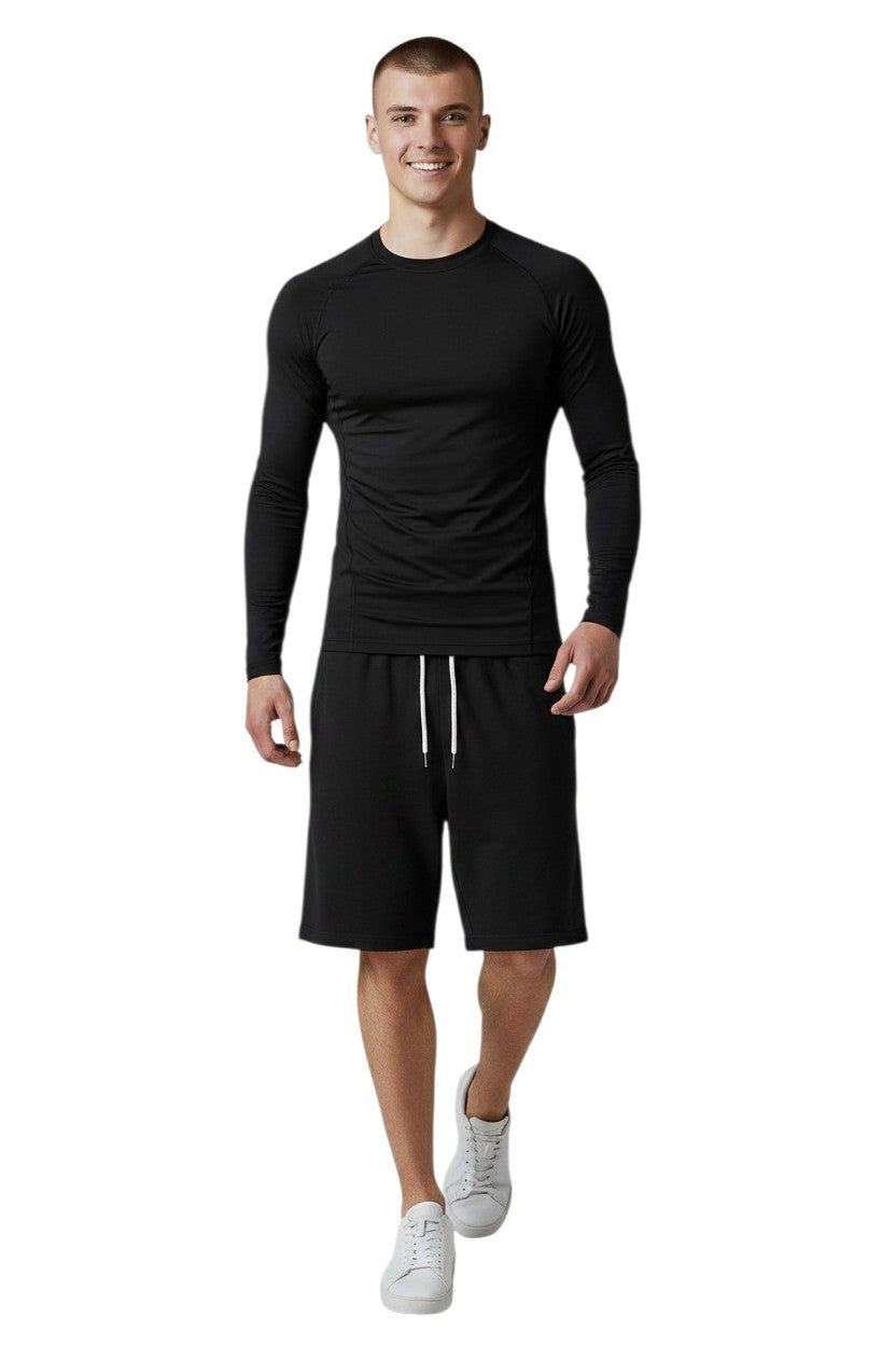 RISE Solid Long Sleeve Crew Neck Rashguard in black, shown on model