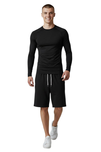 RISE Solid Long Sleeve Crew Neck Rashguard in black, shown on model
