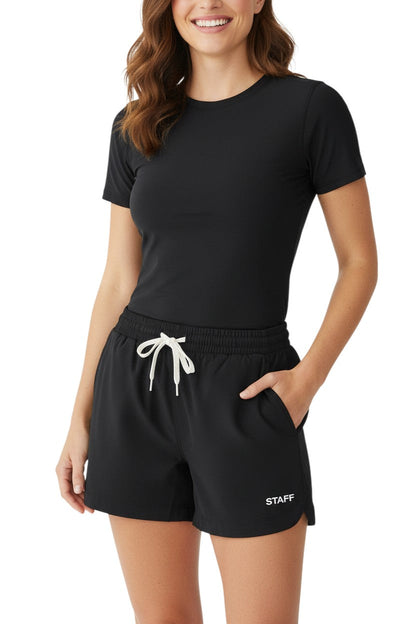 RISE Staff Female Roll Short in black, shown on model