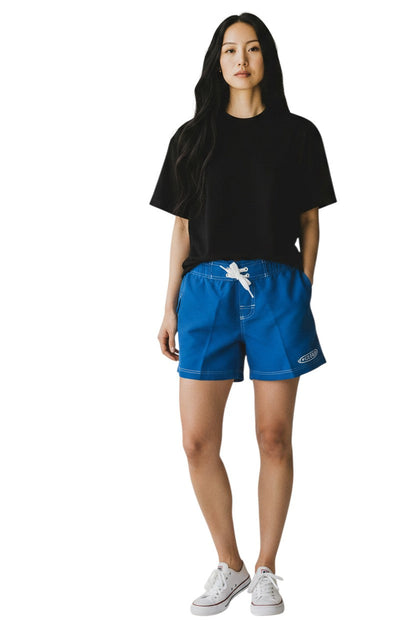 Kiefer blue polyester-spandex blend board shorts with white drawstring and GUARD logo.