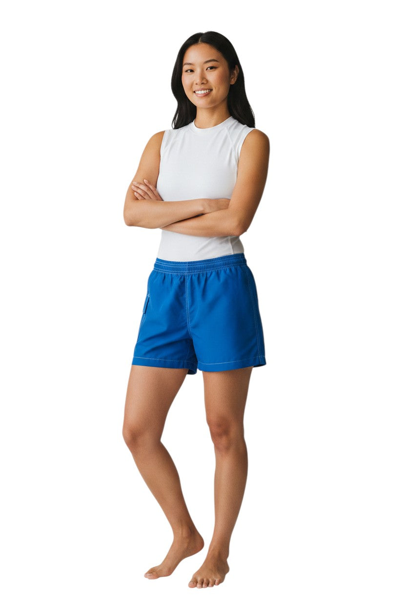 Kiefer RISE solid blue nylon board shorts with 3" inseam, elastic waistband, and side pocket.