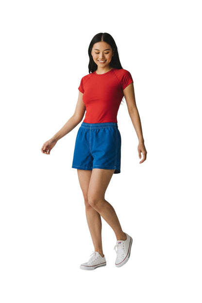 Kiefer RISE solid blue nylon board shorts with 3" inseam, elastic waistband, and side pocket.