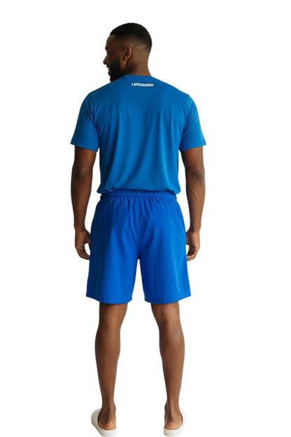RISE Guard Male Flex Board Short in blue, shown on model