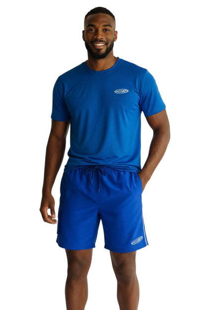 RISE Guard Male Flex Board Short in blue, shown on model