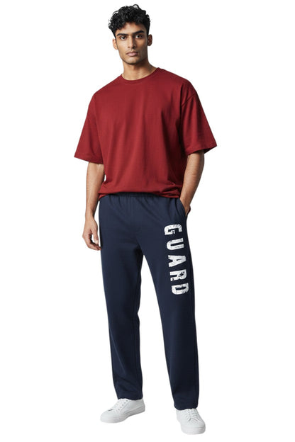 Kiefer RISE Guard Fleece Sweatpants in navy blue with white "GUARD" logo down the leg. 50% cotton, 50% polyester.