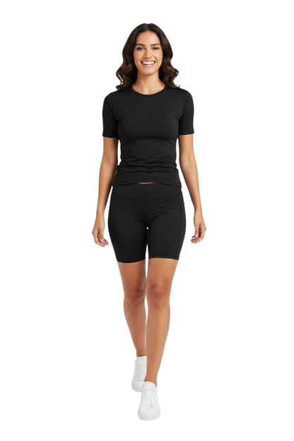 Kiefer Solid Short Sleeve Crewneck Rashguard in black, shown on model
