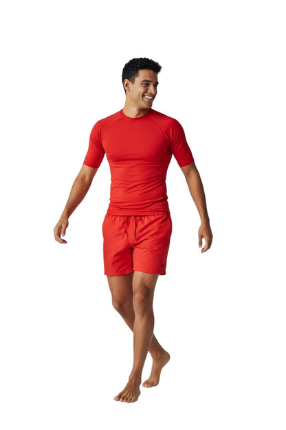 Kiefer Solid Short Sleeve Crewneck Rashguard in red, shown on model