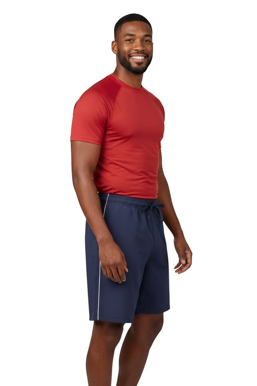RISE Solid Male Flex Board Short in navy, shown on model