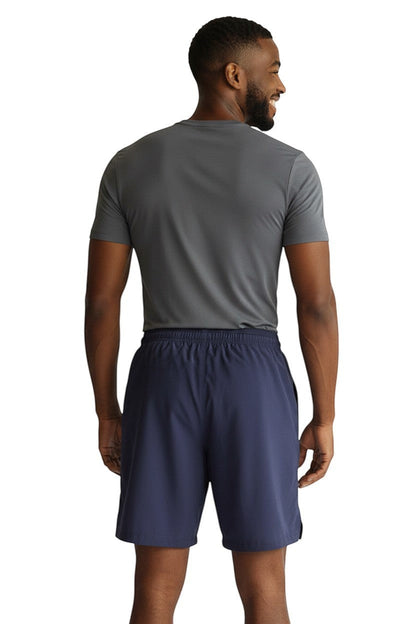 RISE Solid Male Flex Board Short in navy, shown on model