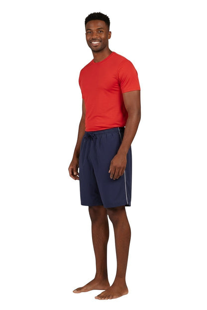 RISE Solid Male Flex Board Short in navy, shown on model