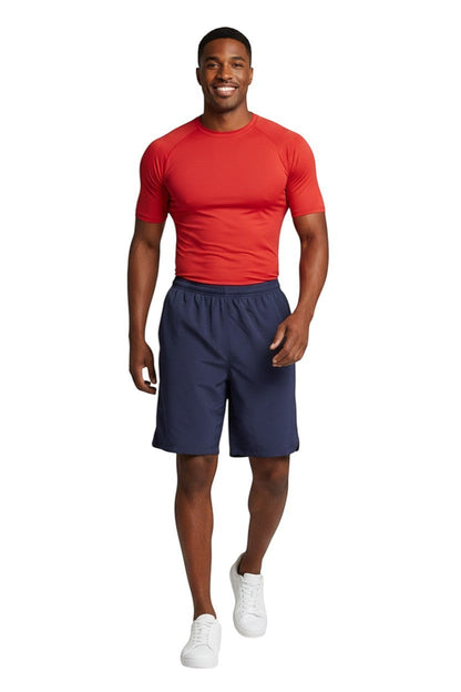 RISE Solid Male Flex Board Short in navy, shown on model