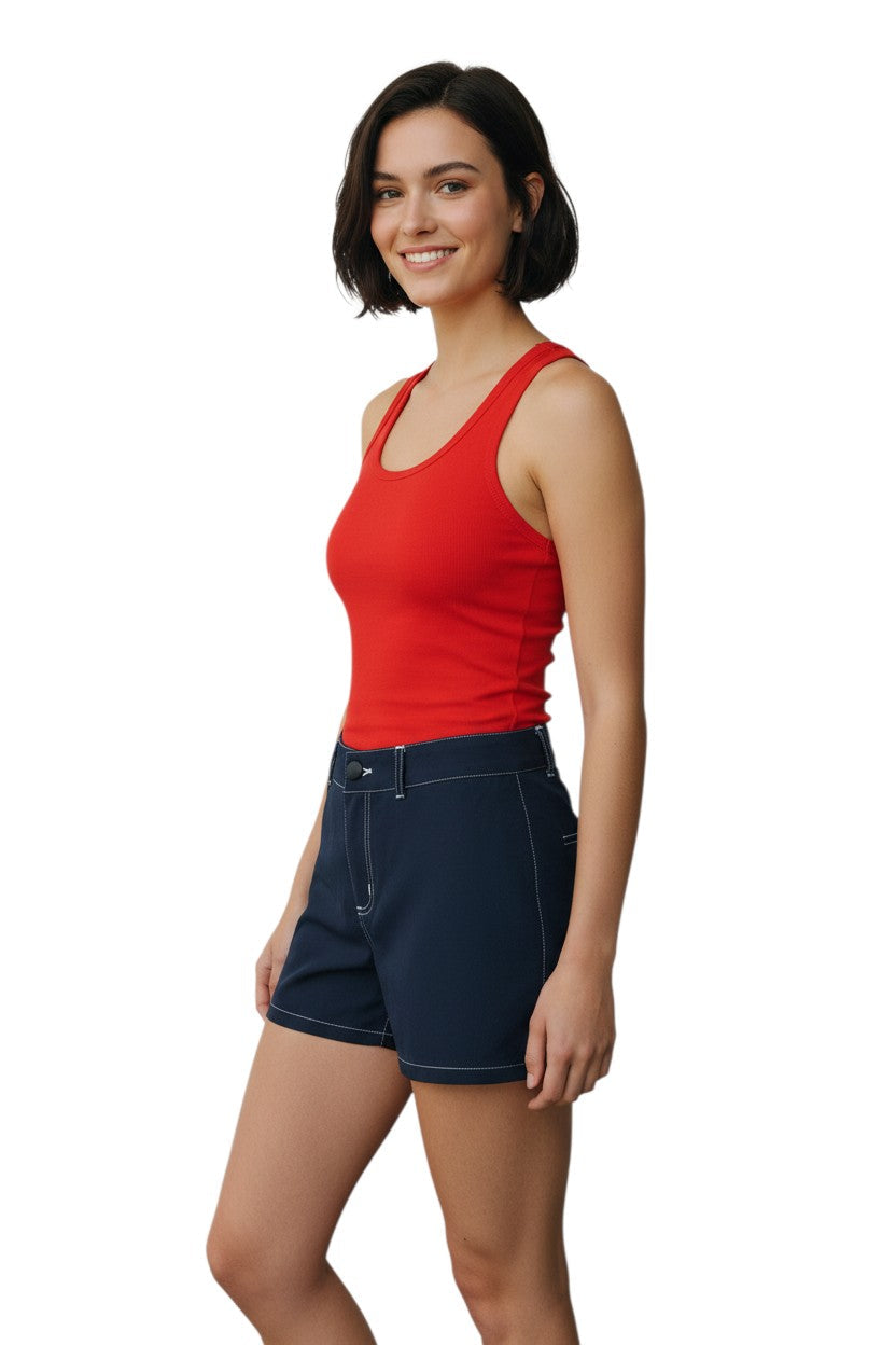 RISE Solid Female Flex Short in navy blue polyester-spandex with white contrast stitching and a 5" inseam.