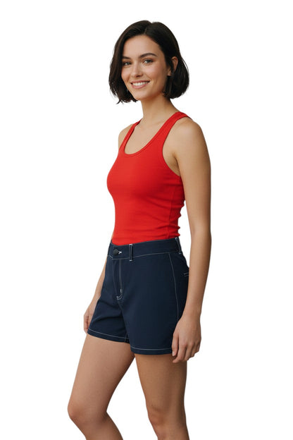 RISE Solid Female Flex Short in navy blue polyester-spandex with white contrast stitching and a 5" inseam.
