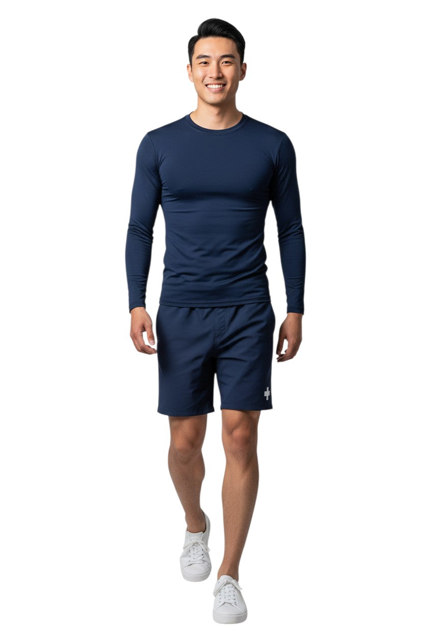 Kiefer Solid Long Sleeve Crewneck Rashguard in navy, shown on model