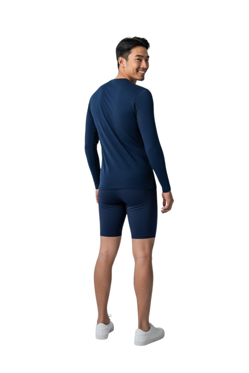 RISE Solid Long Sleeve Crew Neck Rashguard in navy, shown on model