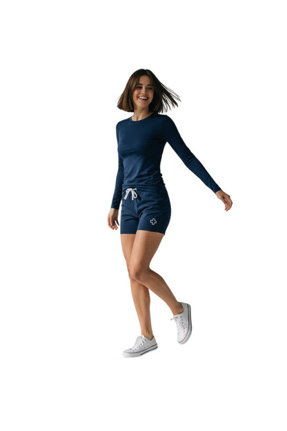 Kiefer Solid Long Sleeve Crewneck Rashguard in navy, shown on model