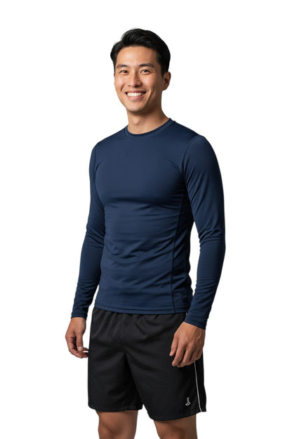 RISE Solid Long Sleeve Crew Neck Rashguard in navy, shown on model