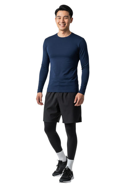 RISE Solid Long Sleeve Crew Neck Rashguard in navy, shown on model