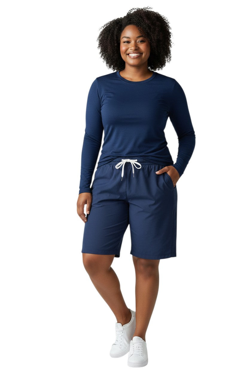 RISE Solid Long Sleeve Crew Neck Rashguard in navy, shown on model