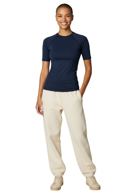 Kiefer Solid Short Sleeve Crewneck Rashguard in navy, shown on model