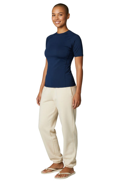 Kiefer Solid Short Sleeve Crewneck Rashguard in navy, shown on model