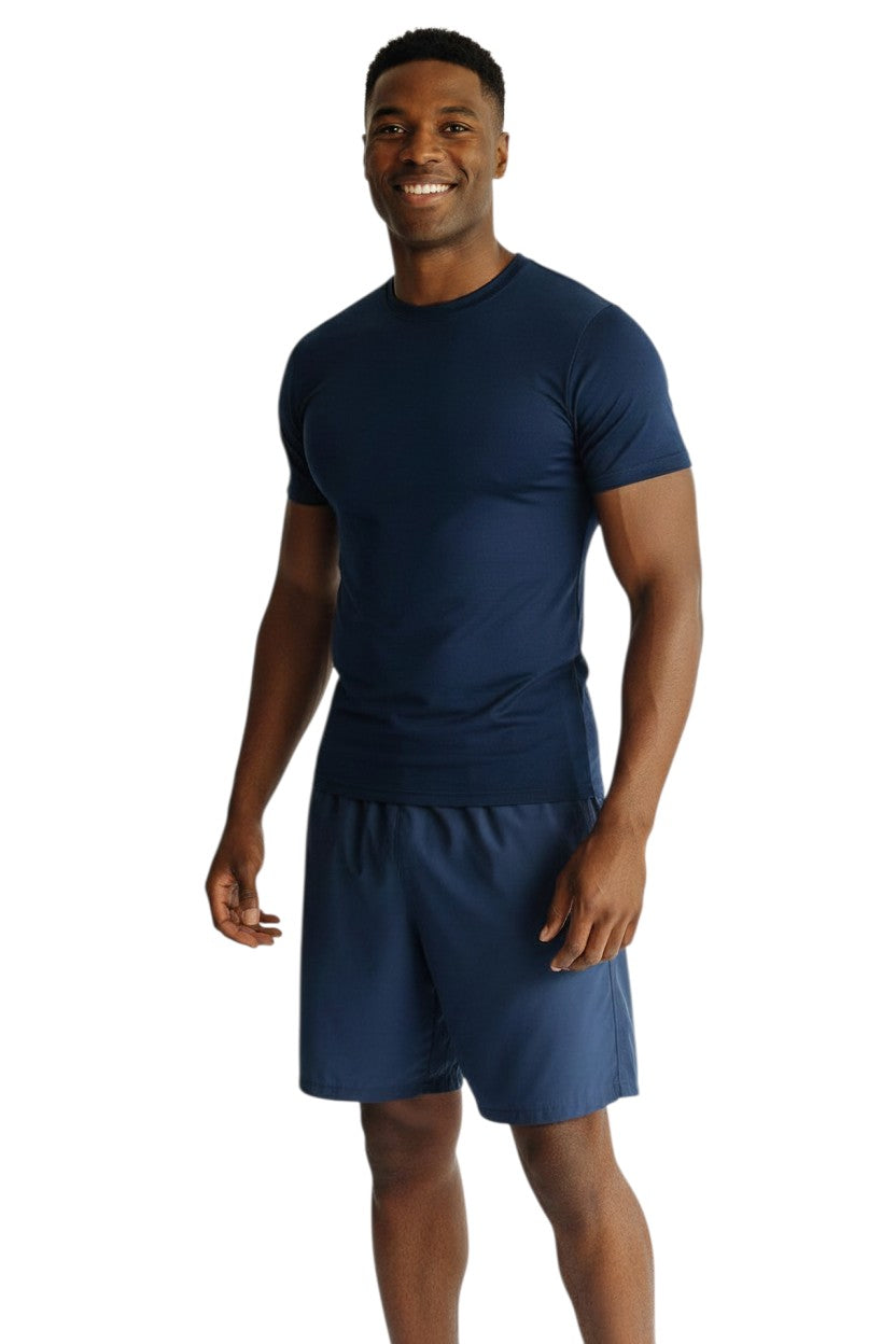 Kiefer Solid Short Sleeve Crewneck Rashguard in navy, shown on model
