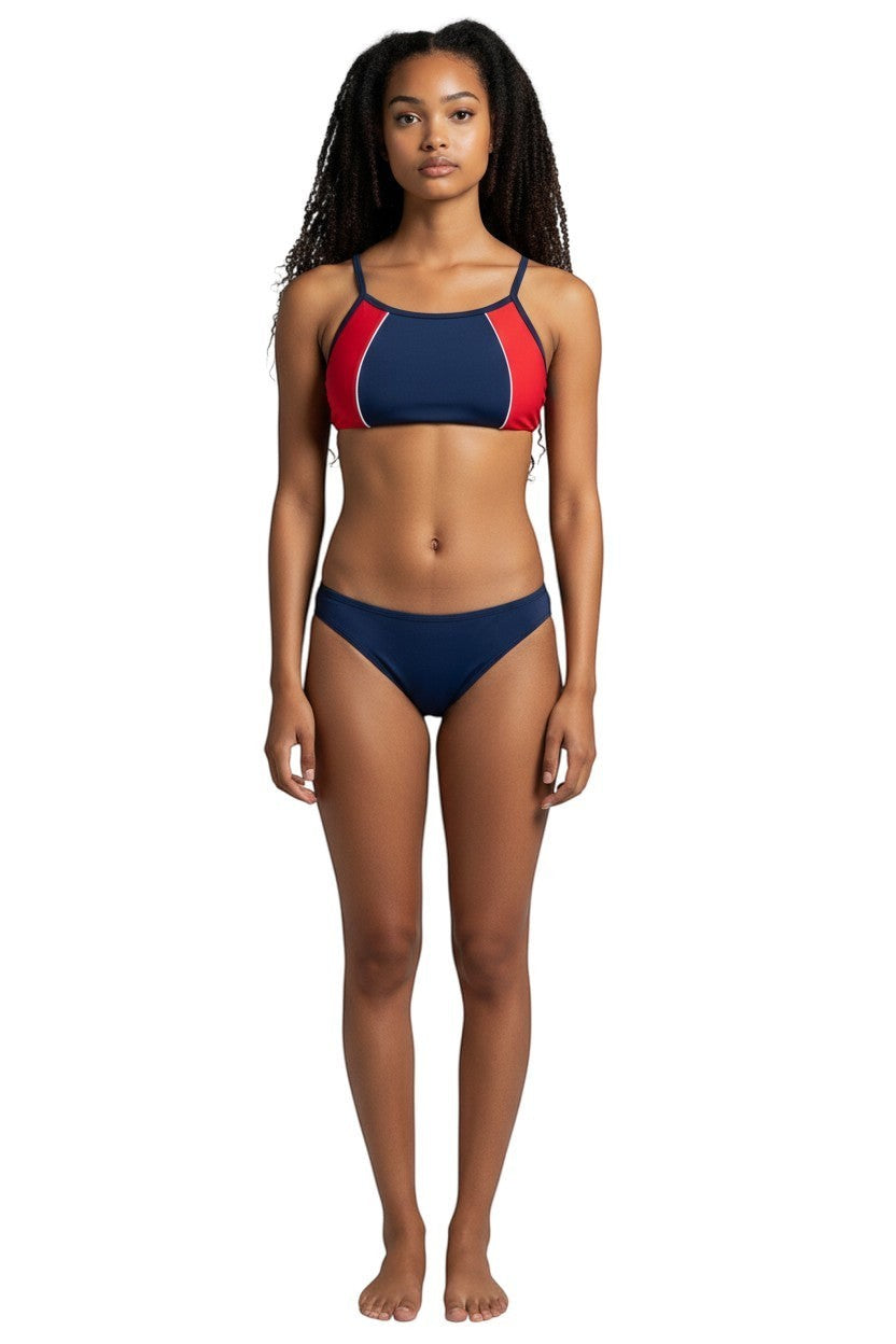 Model wearing Kiefer navy and red athletic two-piece bikini with flat-locked seams for training.