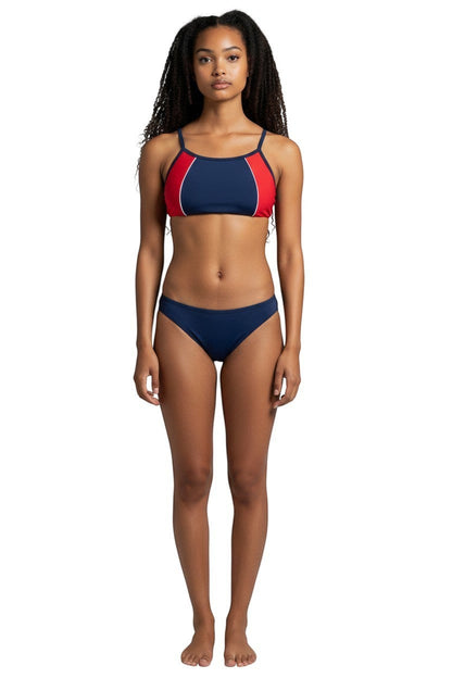 Model wearing Kiefer navy and red athletic two-piece bikini with flat-locked seams for training.