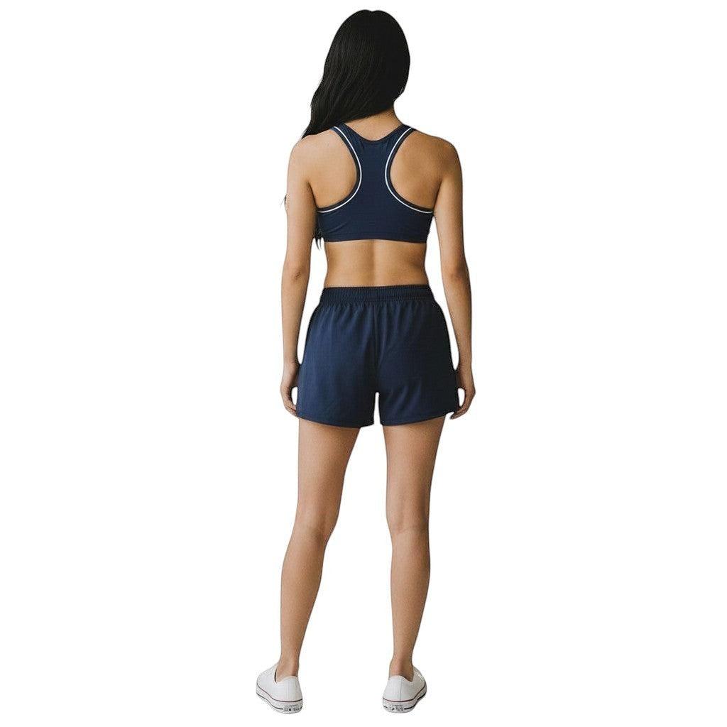 Kiefer navy blue reversible racer back guard top with white trim worn by a woman from the back view.