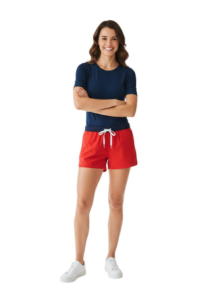 Red polyester comfy shorts with navy waistband, drawstring, and pockets. UPF30+.