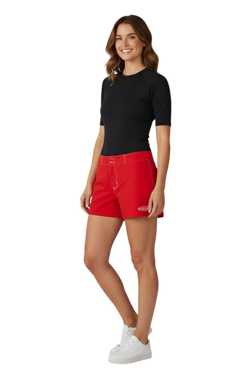 Red polyester-spandex Guard Flex shorts for women with drawstring waist and side pocket. Guard logo on left leg.