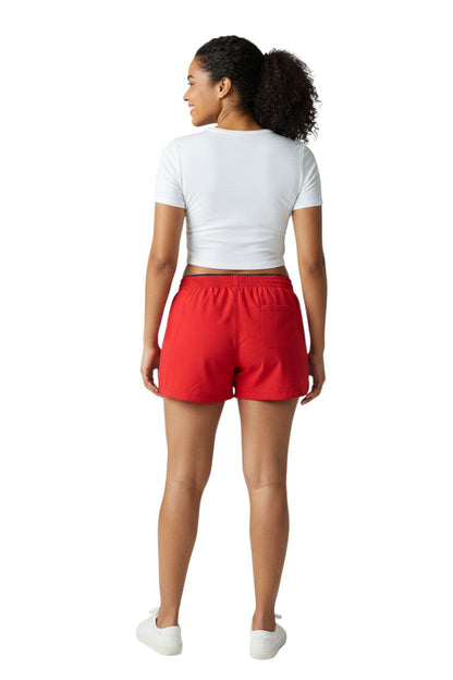 RISE Instructor Female Roll Short in red, shown on model