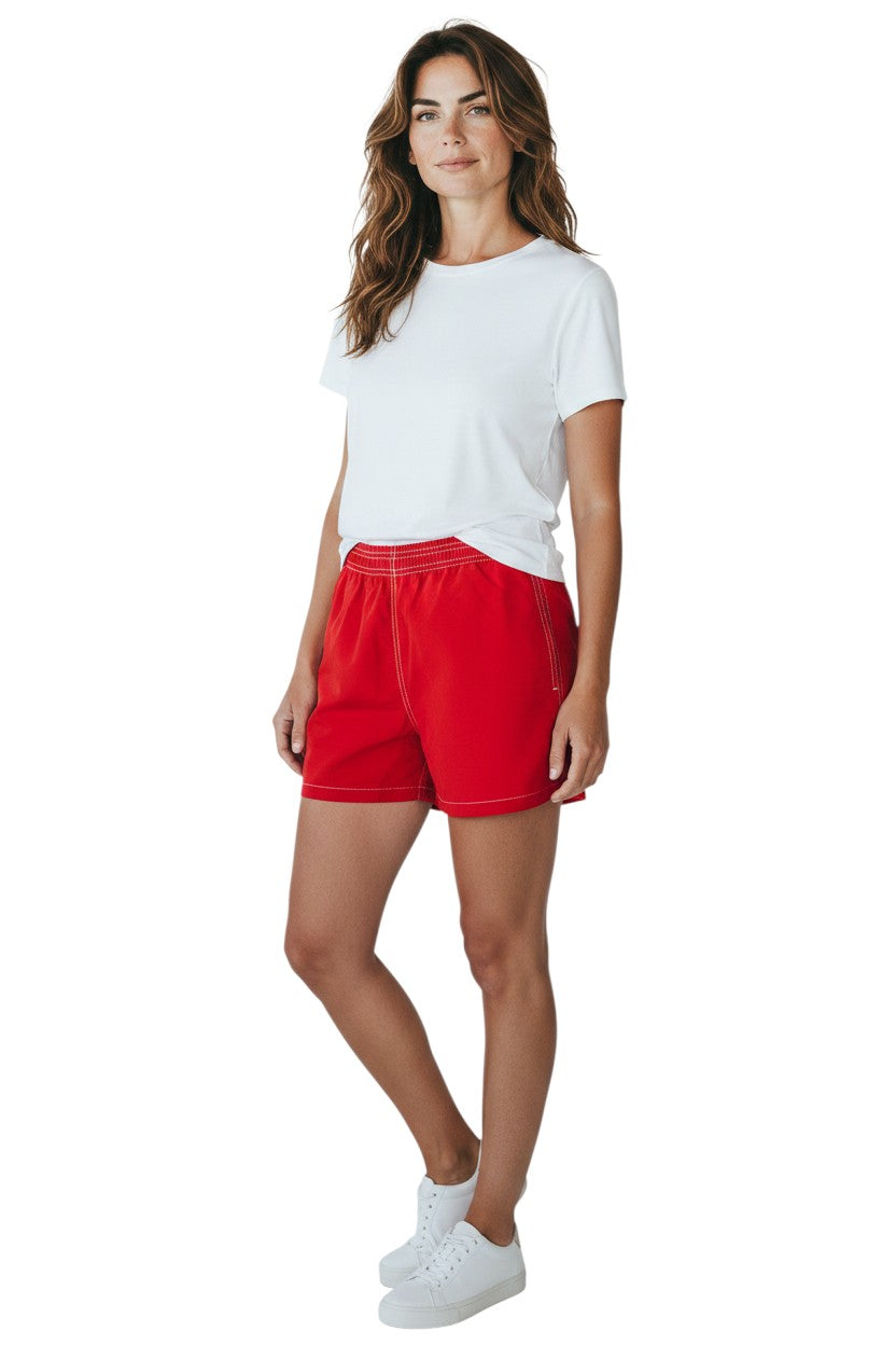 Kiefer red nylon board shorts with elastic waistband, drawstring, and side pocket. 3" inseam.