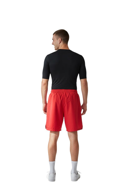 RISE Instructor Male Flex Board Short in red, shown on model