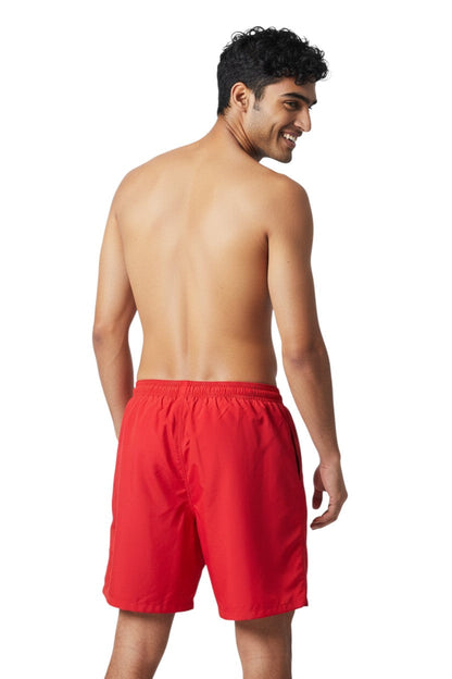 RISE Manager Male Flex Board Short in red, shown on model
