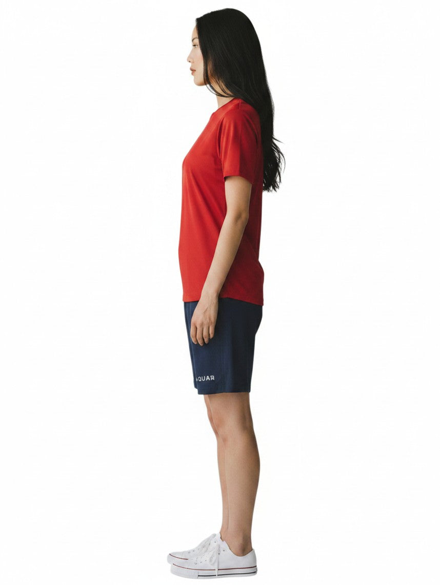 Kiefer RISE red short sleeve crew neck rashguard worn by a woman in profile view