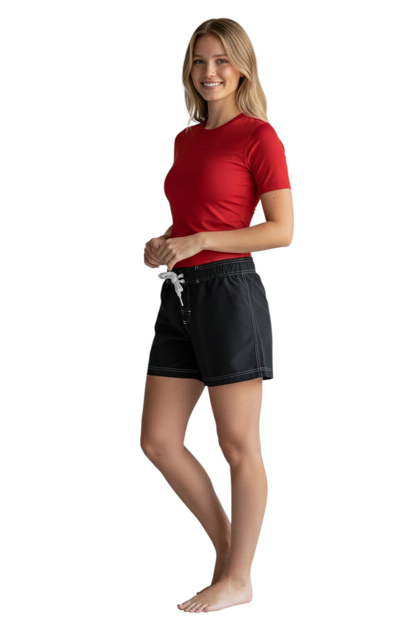 RISE Solid Female Flex Short in black polyester with white contrast stitching, drawstring waist, and side pocket.