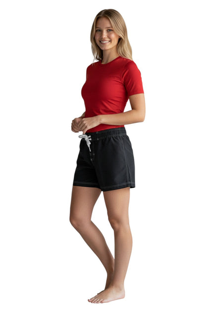RISE Solid Female Flex Short in black polyester with white contrast stitching, drawstring waist, and side pocket.