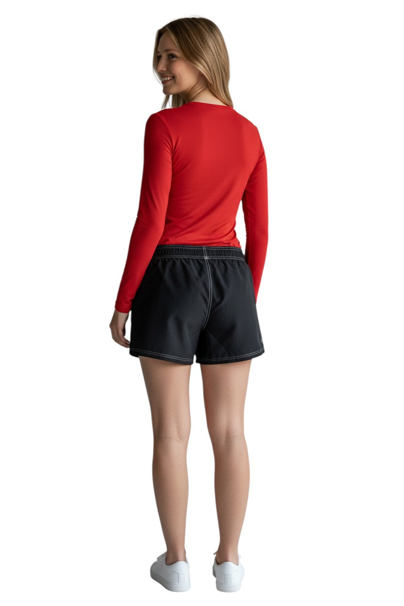 RISE Solid Female Flex Short in black polyester with white contrast stitching, elastic waistband, drawstring, and side pocket.