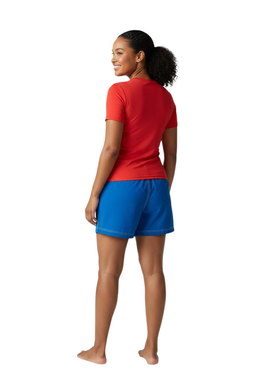 RISE Solid Female Flex Short in royal blue polyester with white contrast stitching, drawstring waist, and side pocket.