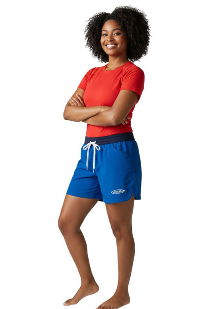 RISE Guard Female Roll Short in royal blue polyester with elastic waistband, drawstring, and two front pockets. Features UPF30+ protection.