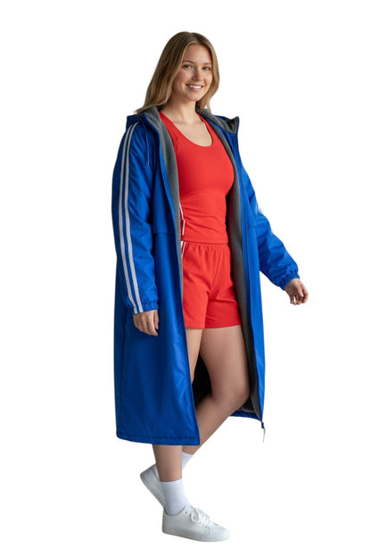 RISE Guard Splice Parka in royal blue nylon with white stripes on sleeves and fleece lining.