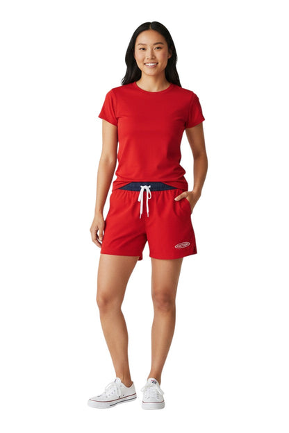 RISE Guard red polyester roll shorts with navy waistband and white drawstring, 4-inch inseam.