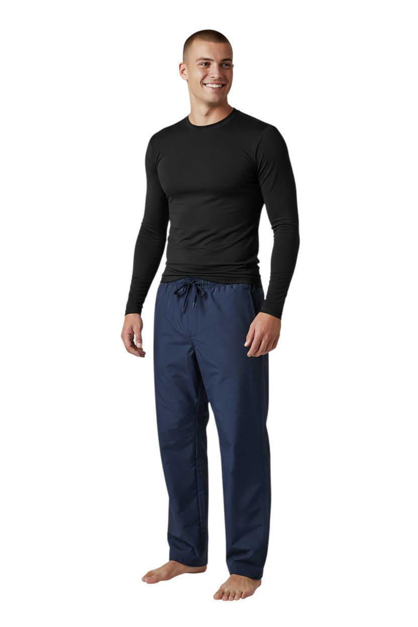 RISE Solid Long Sleeve Crew Neck Rashguard in black, shown on model