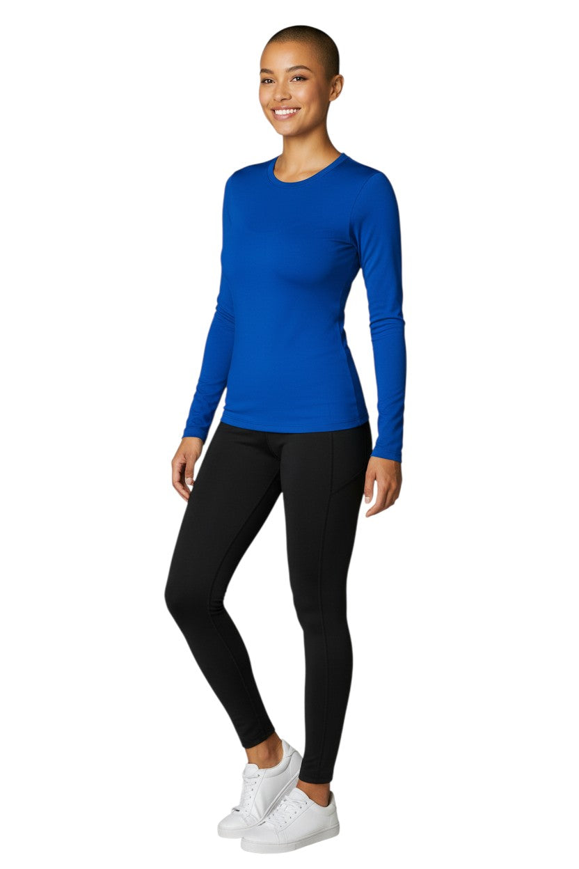 RISE Solid Long Sleeve Crew Neck Rashguard in blue, shown on model