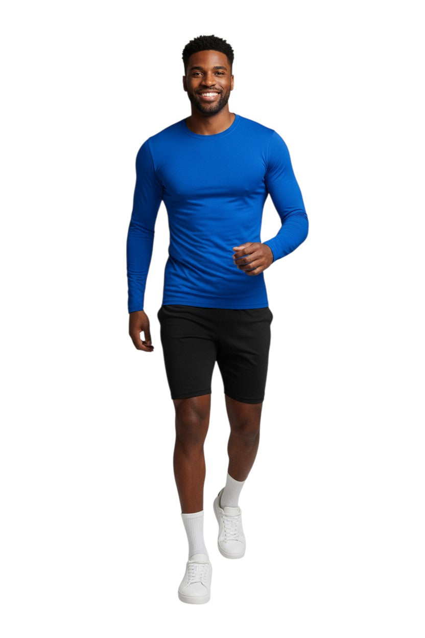 RISE Solid Long Sleeve Crew Neck Rashguard in blue, shown on model