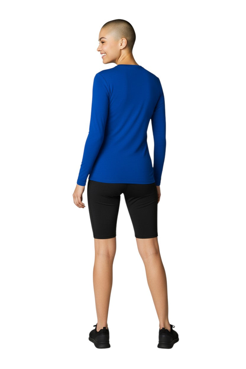 RISE Solid Long Sleeve Crew Neck Rashguard in blue, shown on model