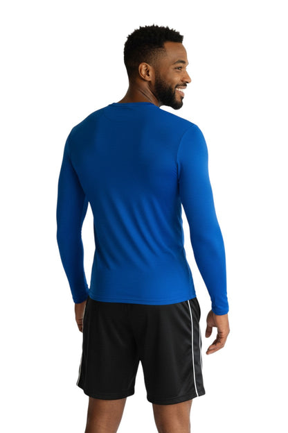 RISE Solid Long Sleeve Crew Neck Rashguard in blue, shown on model